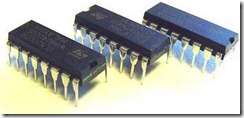 Figure 2.2. These three typical ICs all contain a tiny silicon chip housed in a black plastic package for easy handling. The sixteen metal