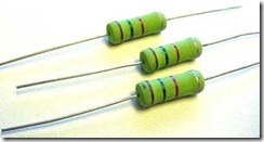 Figure 2.5. Resistors are among the simplest electronic components. These three resistors are smaller than a pencil eraser and the wires o