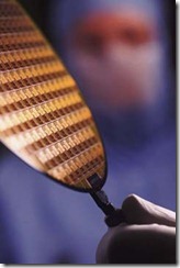 Figure 5.18. A completely processed wafer makes dozens or hundreds of finished chips, all exactly the same. Courtesy of Texas Instruments.